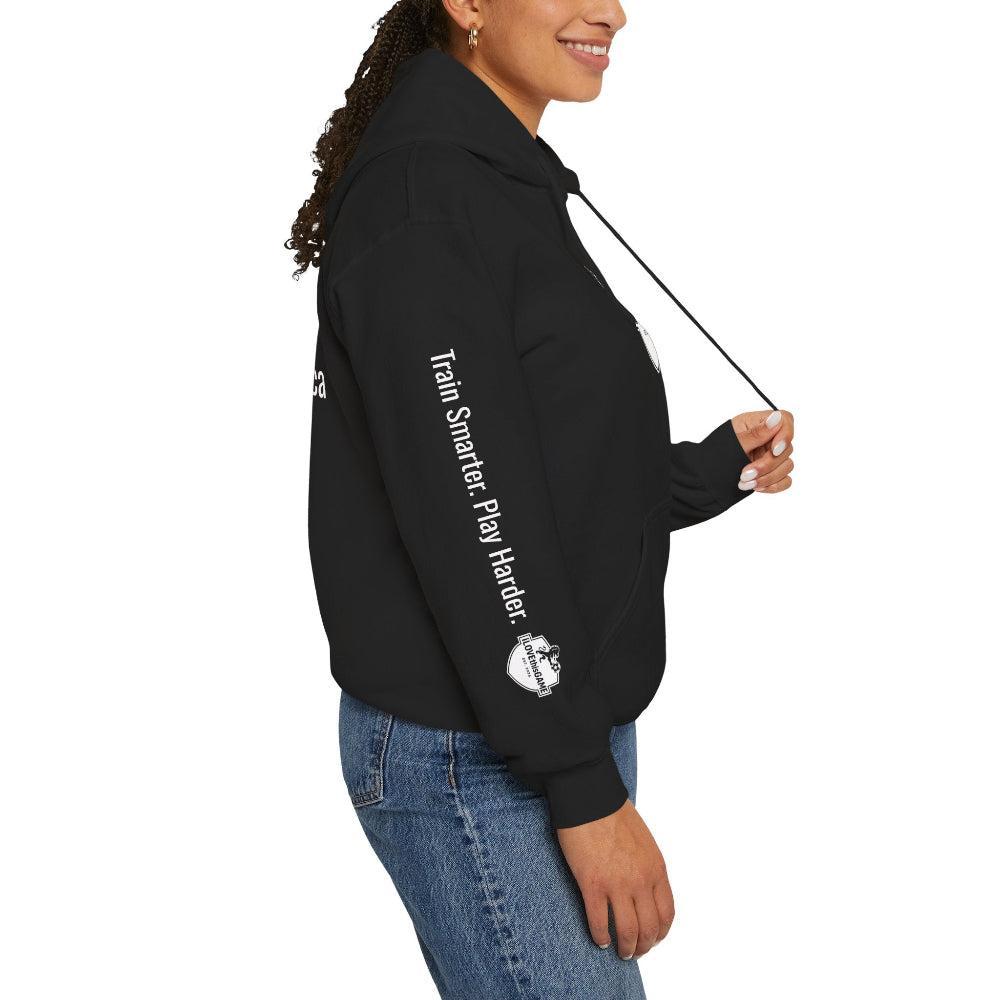Person wearing a black hoodie with text and graphics on a white background