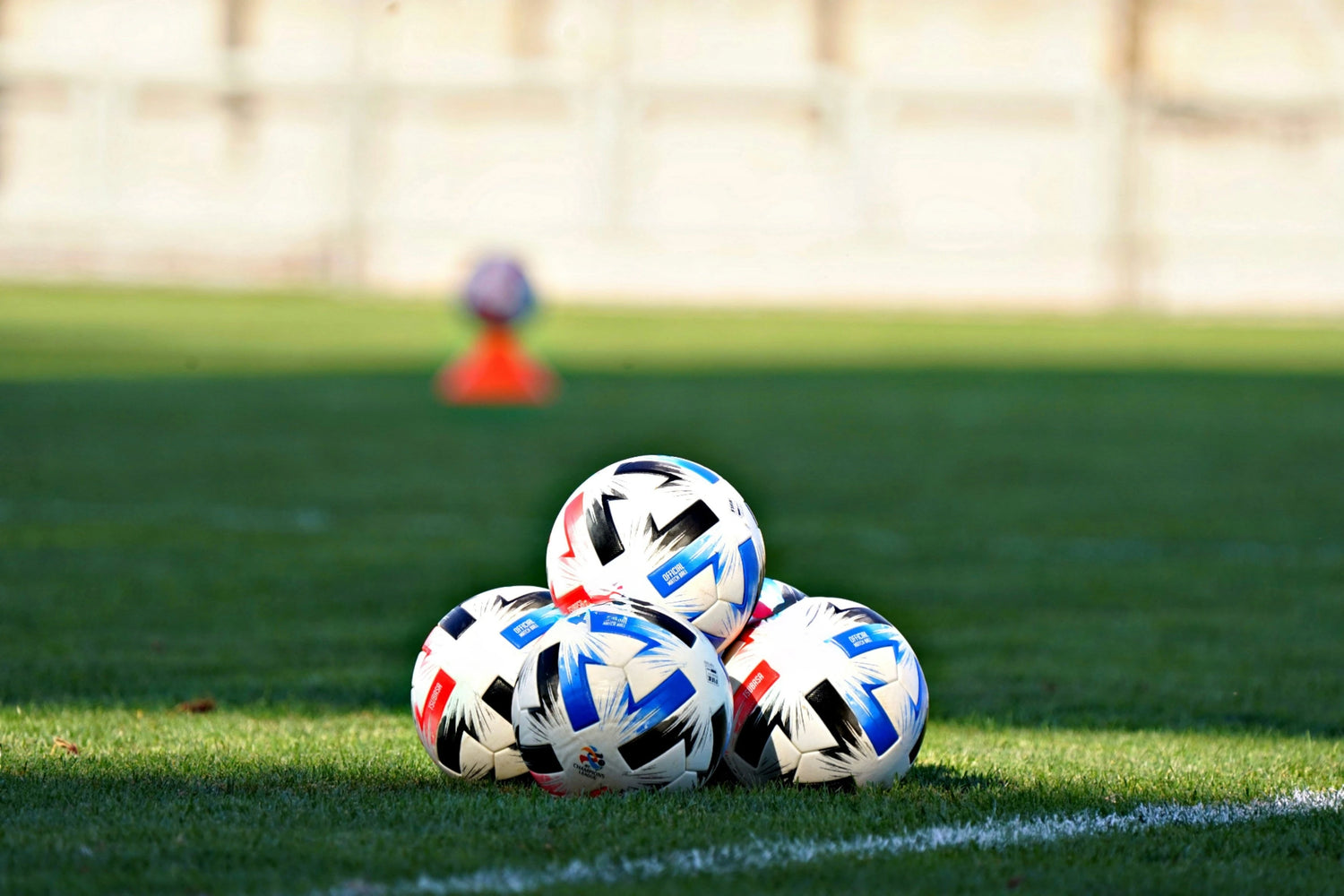 Soccer Balls placed on a soccer field during training