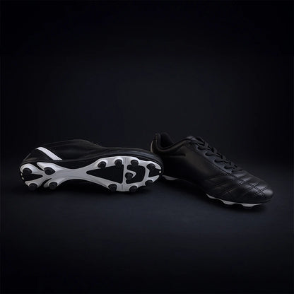 Black Avtiare Classico Cleats on a black background.