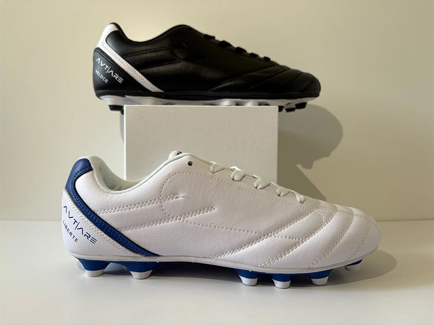 Avtiare Classico Black and white soccer cleats with blue accents on a white surface.