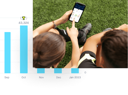 Kids looking at Playermaker & CITYPLAY app to compare statistics